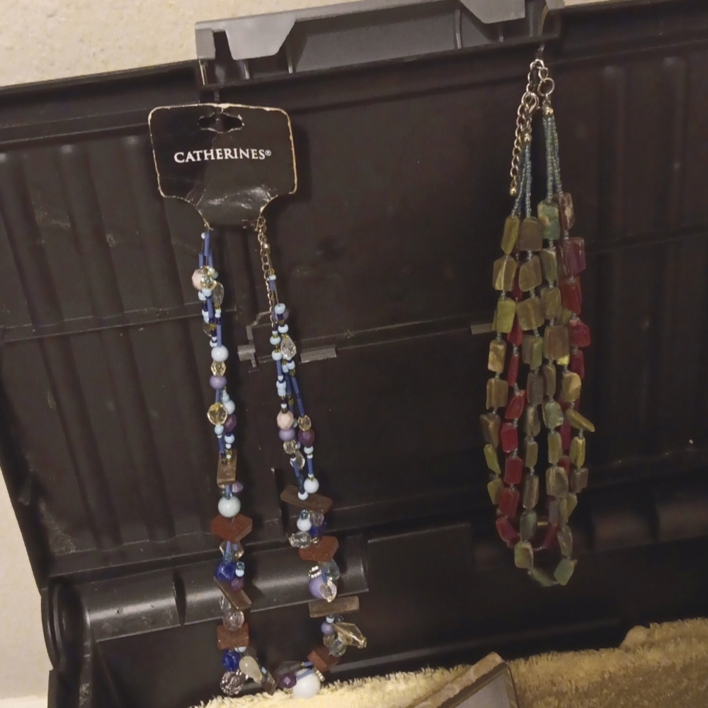 Necklaces and a butterfly brooch